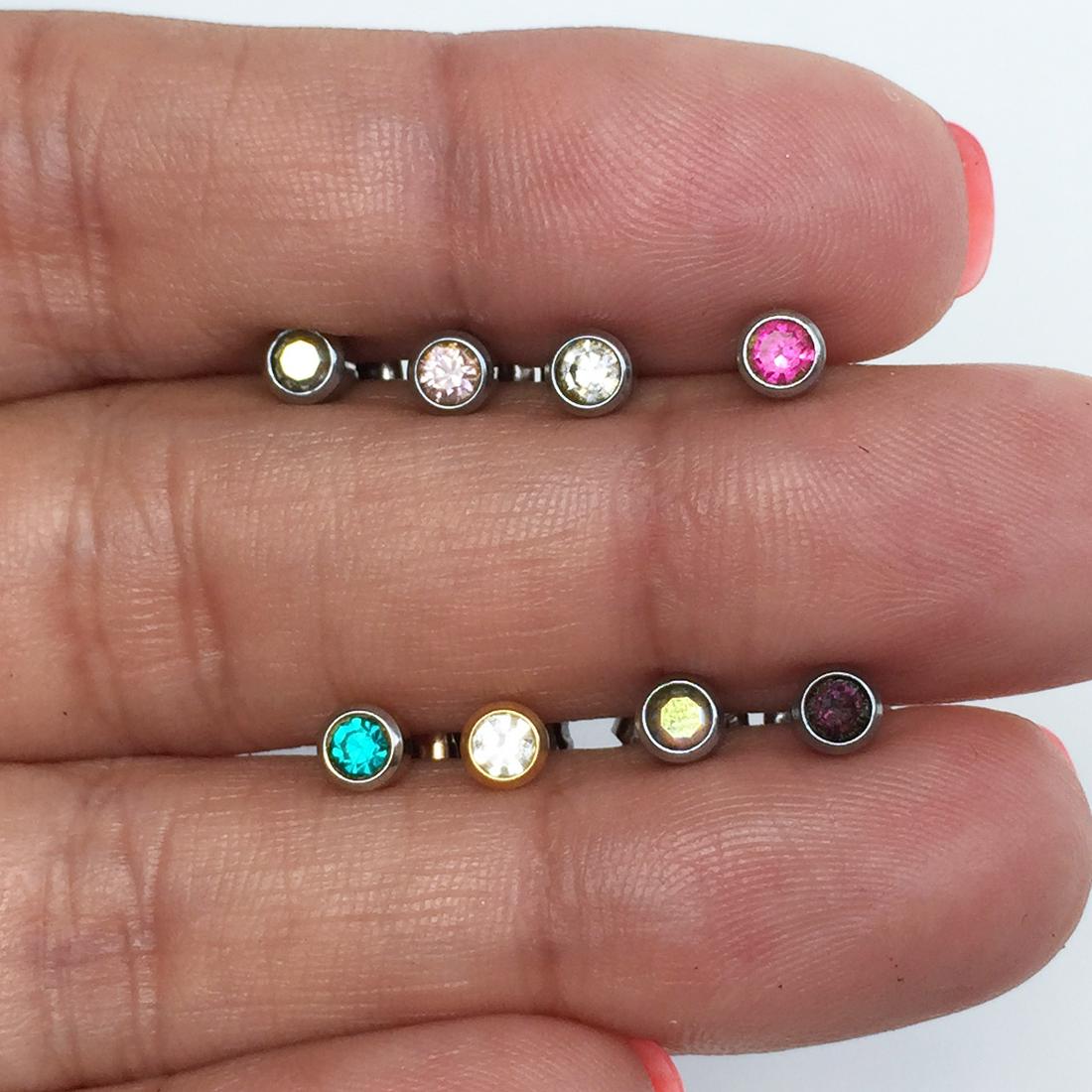 8 silver and gold tone piercing push back studs (1 of 3)