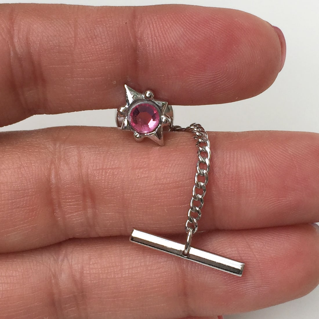 Silver tone pink rhinestone Star Sun tie pin: Silver tone pink rhinestone Star Sun tie pin. Pin length 1/2 inches. Condition very good.