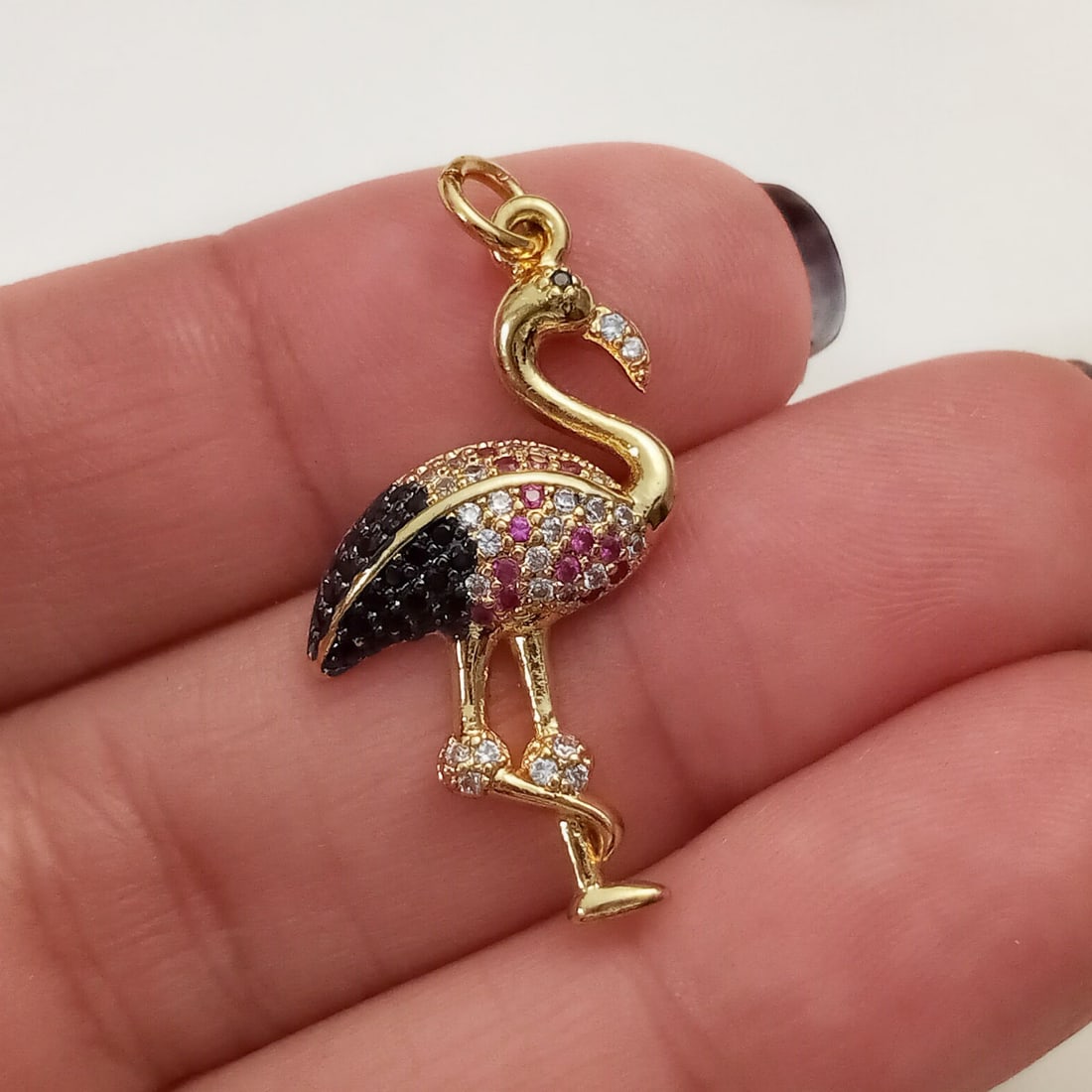 Gold tone multi color pave set CZ Flamingo bird pendant: Gold tone pave set multi color CZ Flamingo bird charm pendant. Length 1 1/8 inches with bail. Condition excellent.