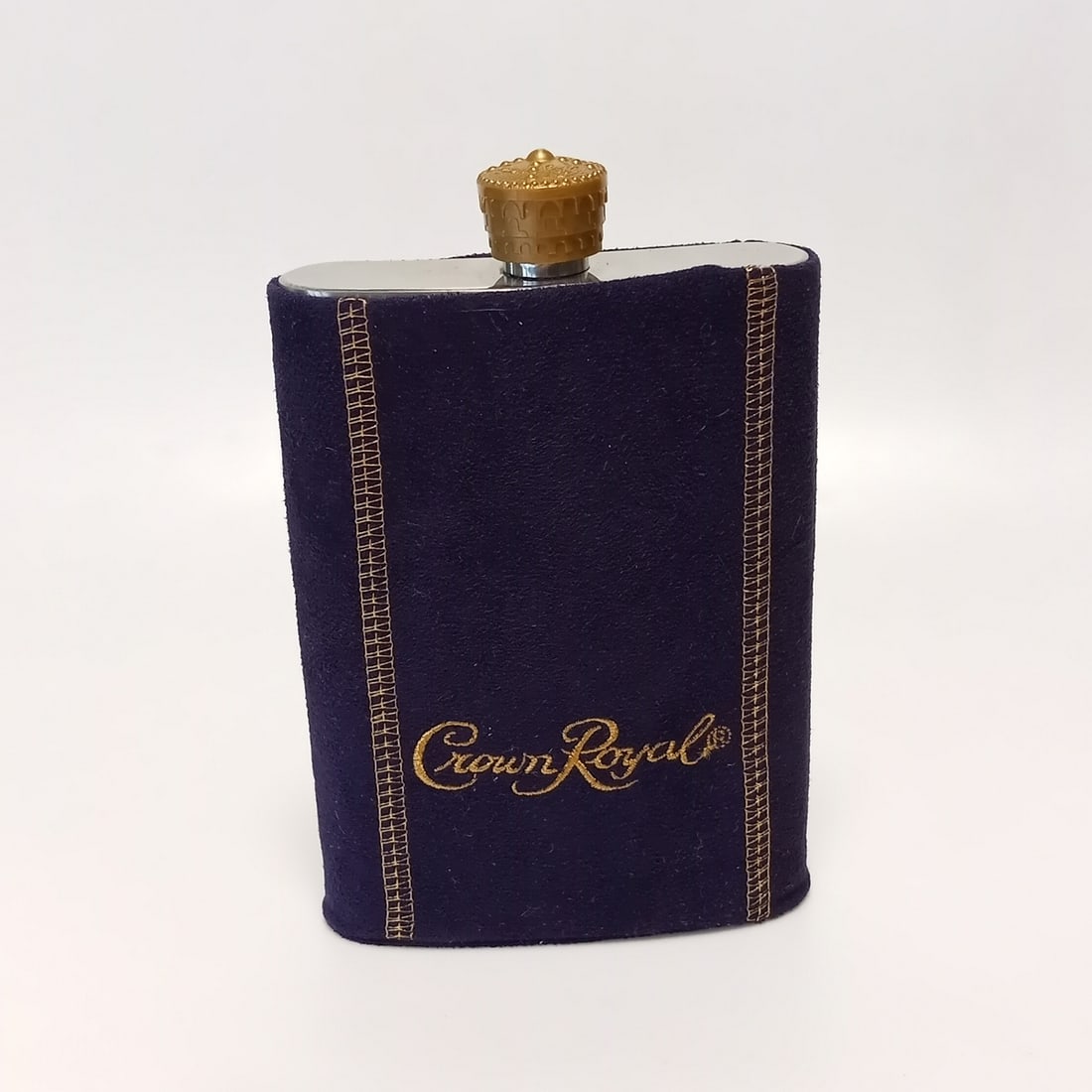 Crown Royal suede purple and gold sleeve stainless steel flask: Crown Royal suede purple and gold sleeve stainless steel flask. Flask has the original crown cap, measured 5 x 3 3/4 x 1 inches. 8 oz. Never used. Condition excellent