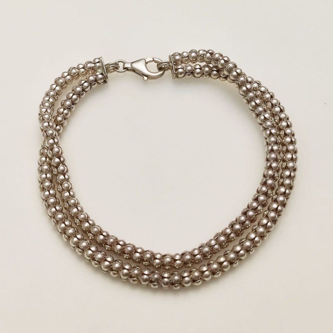Sterling silver double Popcorn Coreana chain bracelet: Sterling silver double Popcorn Coreana chain bracelet. Weight 11.3 grams. Length 8 3/8 inches, total width 3/8 inches. Hallmarked 925. Condition very good.