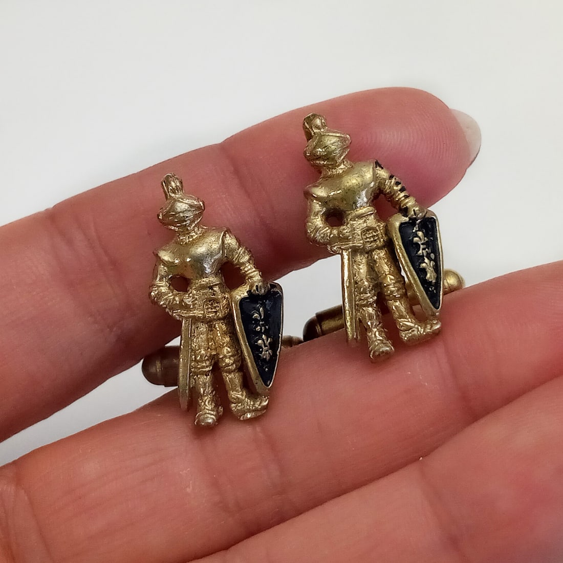 Vintage gold tone knight with sword and shield shape cufflinks: Vintage gold tone knight with sword and shield shape cufflinks. Measured 1 x 1/2 inches. Condition good.