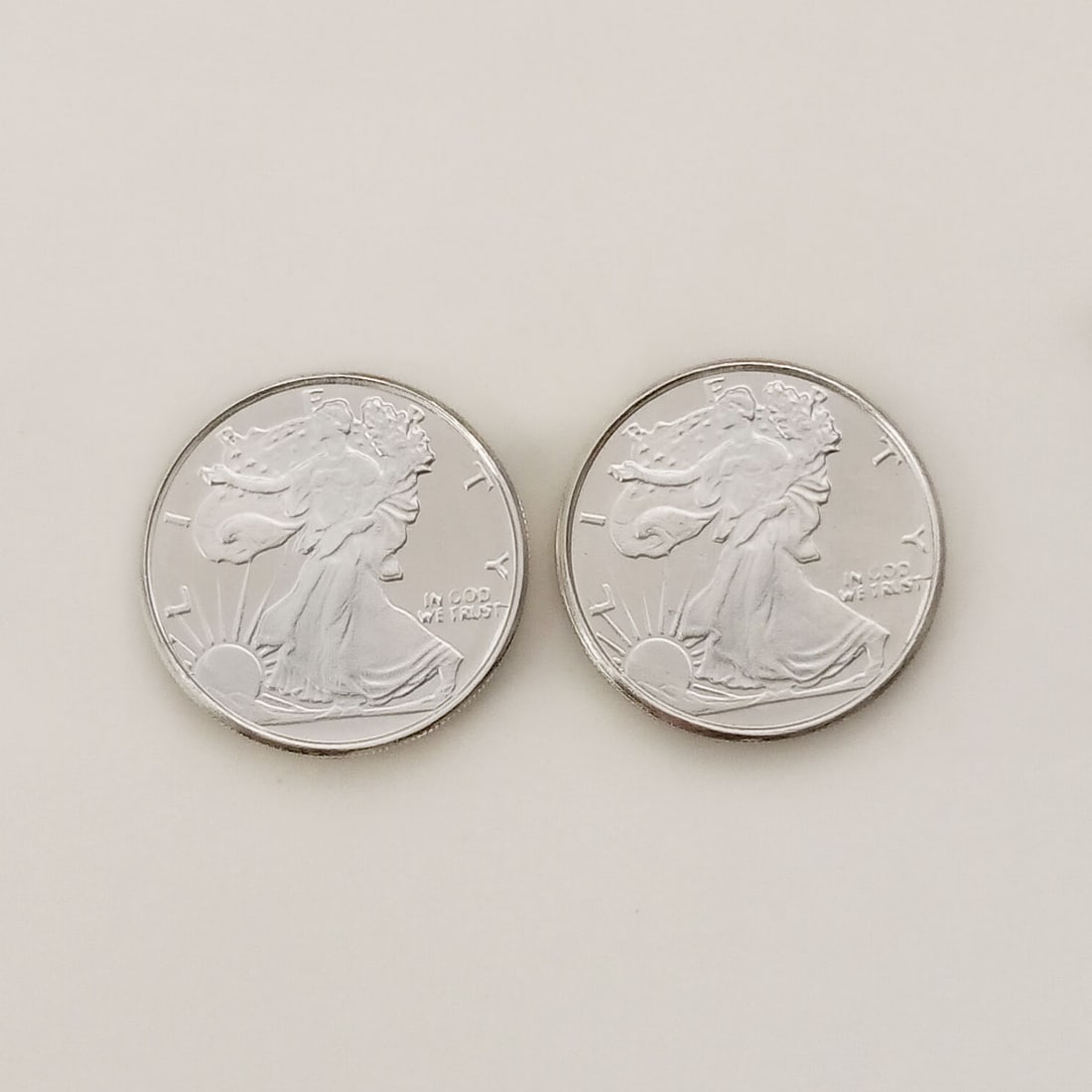 Lot of 2 US Walking Liberty 1/10 oz Fine silver rounds: Lot of 2 Collectible United States Walking Liberty American Eagle 1/10 troy oz .999 Fine Silver rounds bullions. Each is: 1/10 .999 fine silver, 18 mm round. Pure silver 1/10 oz Walking Liberty Rounds