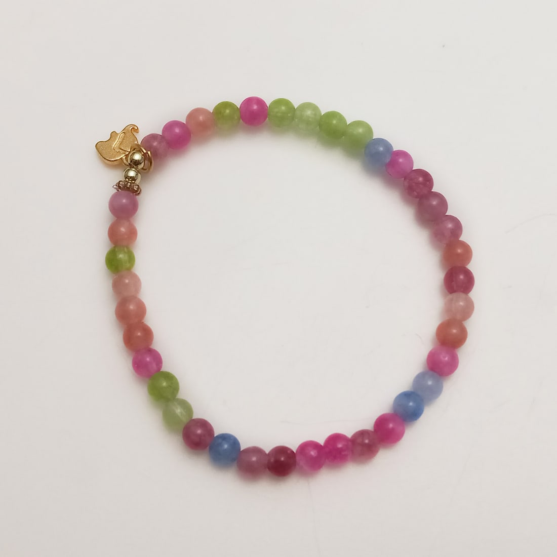 4 mm round shape tourmaline beads stretch bracelet with gold tone elephant charm (1 of 2)