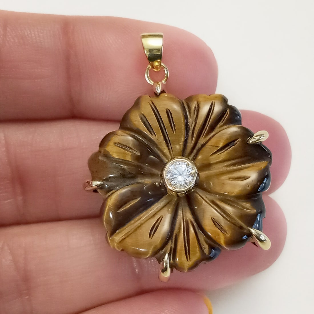 Gold tone rhinestone carved Tiger eye flower pendant: Gold tone clear rhinestone carved Tiger eye flower shape pendant. Length 1 3/8 inches with bail. Condition excellent.