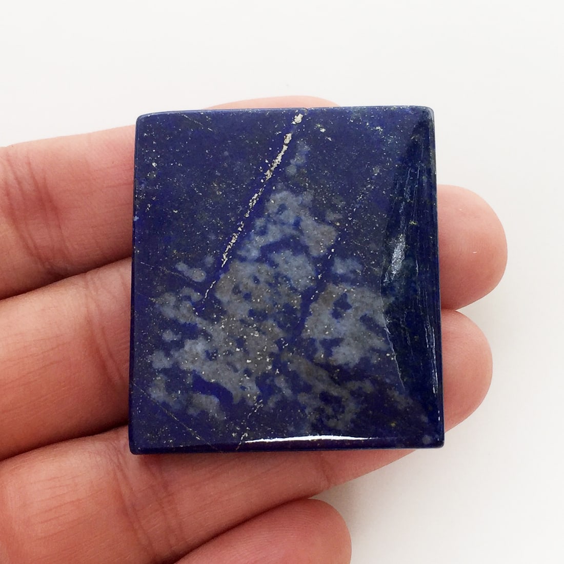 Lapis Lazuli Rectangular shape flat slab cab 126 cts: Lapis Lazuli Rectangular shape flat slab cabochon, weight 126 cts. Measured 38.7 mm x 34.1 mm. Lapis has vivid color with natural discolorations and gold flecks.