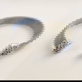 Silver tone st steel TOUS style Bear mesh bracelet: Silver tone stainless steel TOUS style Bear with hearts cutouts mesh cuff bracelet. Bracelet is 3/8 inches wide, Bear is 1/2 inches wide. Bracelet length end to end 7 inches, will fit wrists from 7 3/