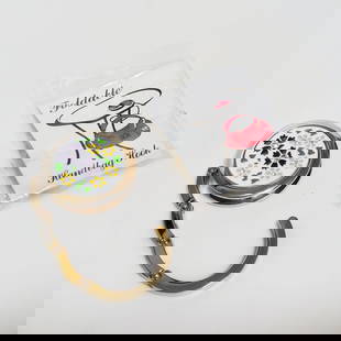 Silver tone yellow black white Flower Handbag hook: Silver tone textured finish yellow, black and white Flowers round shape foldable Handbag hook. Measured 1 3/4 inches in diameter. Length from the bottom of the disc to the top of the hook is 2 1/2 inc