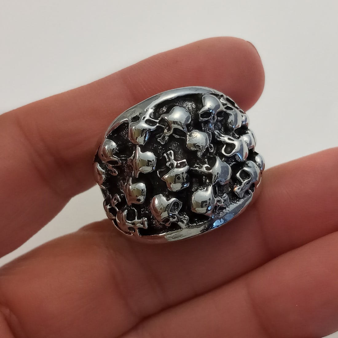 Silver tone with blacken finish skulls ring, size 13: Silver tone with blacken finish skulls ring, size 13. Top measured 7/8 inches wide. Condition excellent.