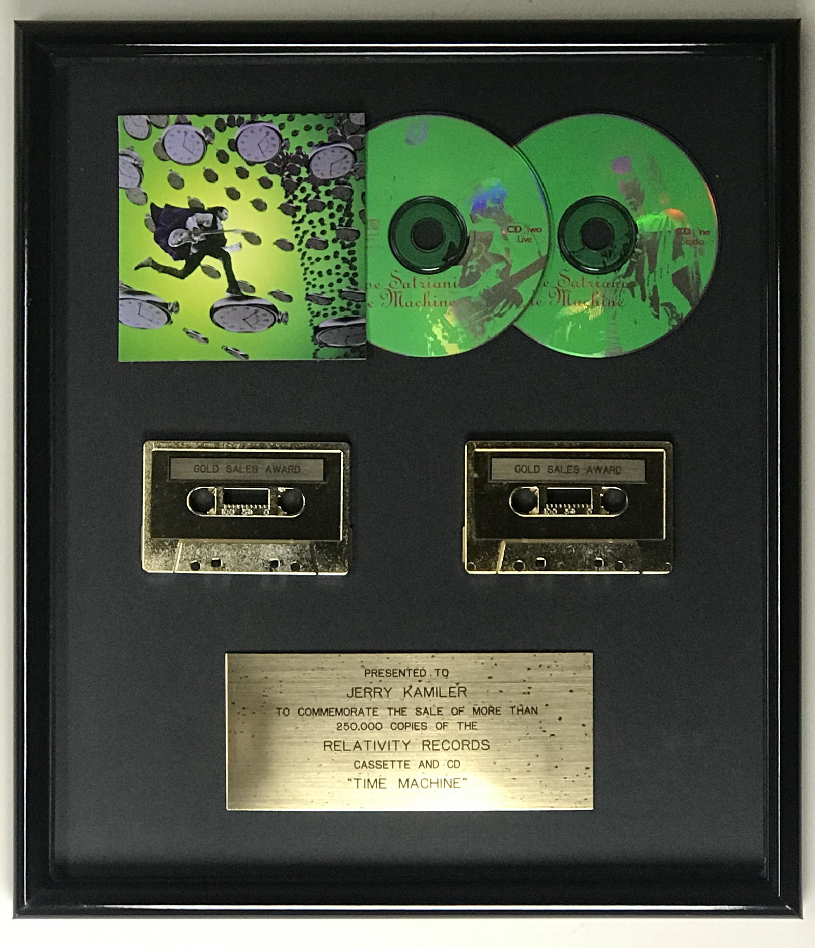 Joe Satriani Time Machine label award: Label Relativity Records award for Joe Satriani's Time Machine album recognizing sales of 250,000 copies. Released Oct. 13, 1993, the album is the fifth studio release from Satriani. It rose as h