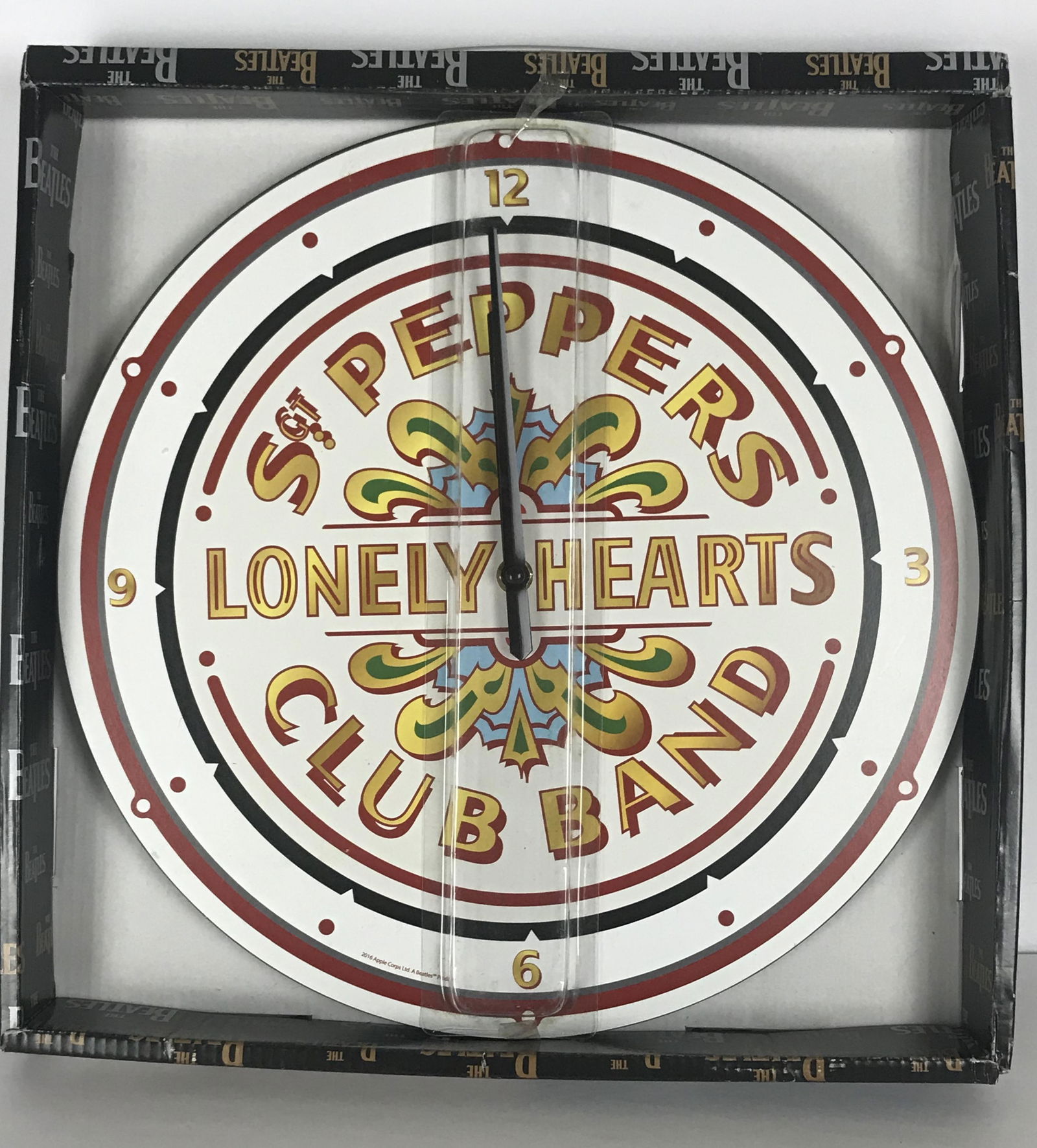 Beatles Sgt Pepper Wall Clock - New In Box: Officially licensed Beatles Sgt Pepper wall clock. Measures approx. 12" across. Battery operated. New, never used in original packaging. Features: Officially licensed Beatles Sgt Pepper wall clo