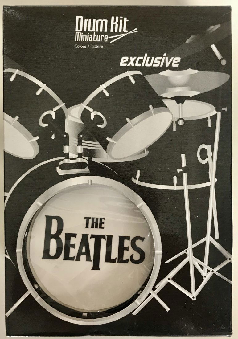 Beatles Ringo Starr Mini Drumkit - New In Box: Beatles Ringo Starr mini drum set, new in original packaging. Made from metal, plastic and even features wood drum sticks. Great detail from bass drum, Ringo's traditional single tom to metal cymbals.
