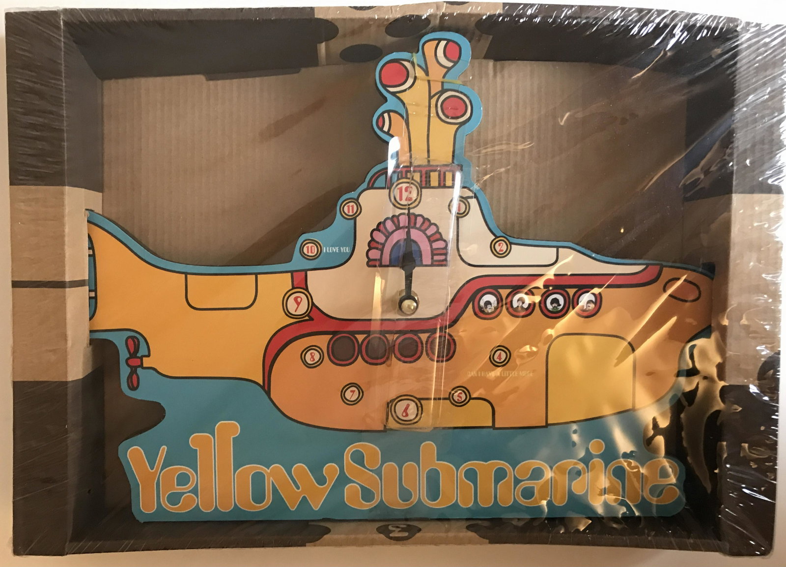 Beatles Yellow Submarine Wall Clock - New In Box: Officially licensed Beatles Yellow Submarine wall clock. Measures approx. 12" across. Battery operated. New, never used in original packaging. Features: Officially licensed Beatles Yellow Submar