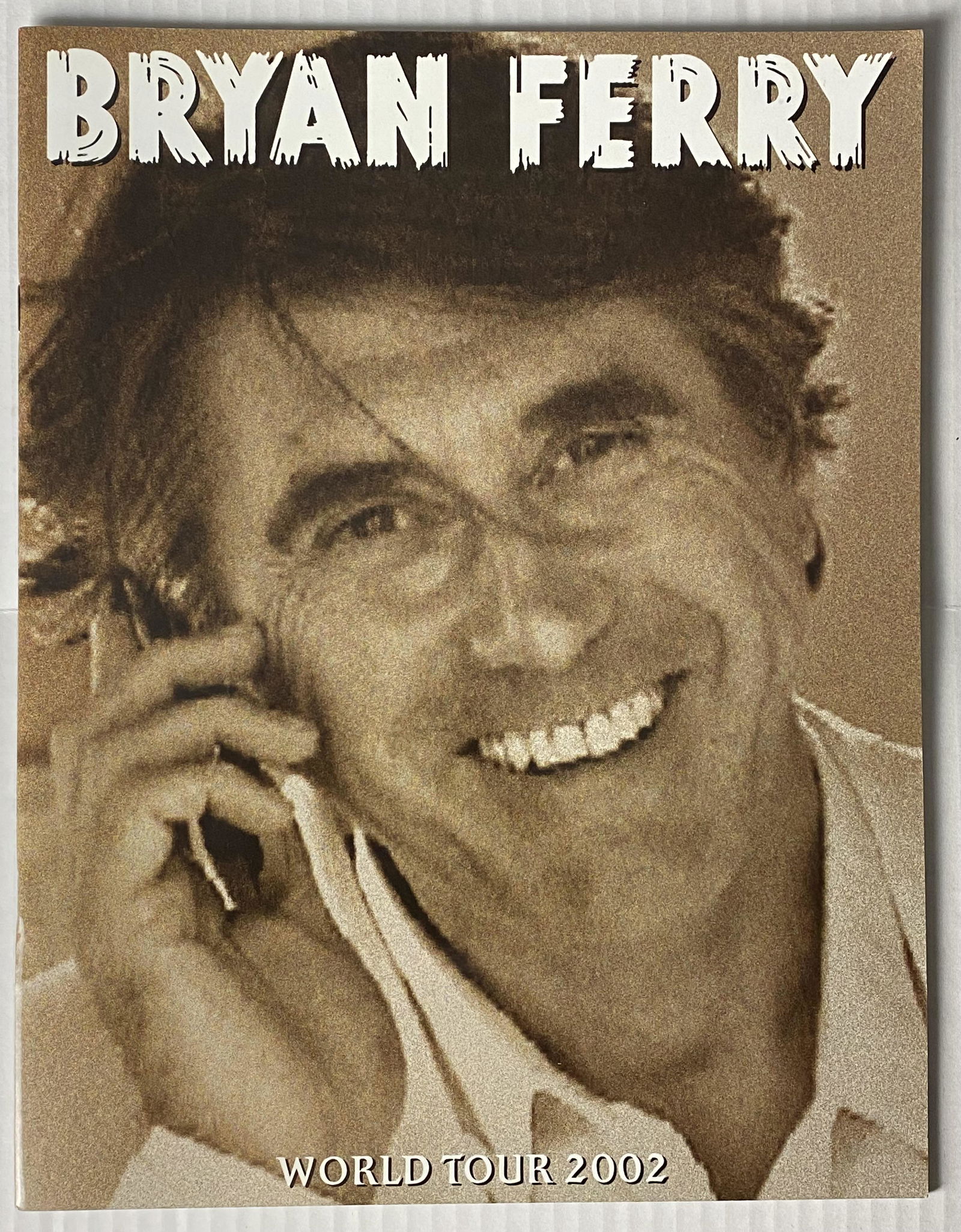Bryan Ferry 2002 World Tour Program: Fantastic vintage tour program for the 2000 Bryan Ferry World Tour. Great artwork and photos on the front back and throughout. The program book features photos and information about the artist and of