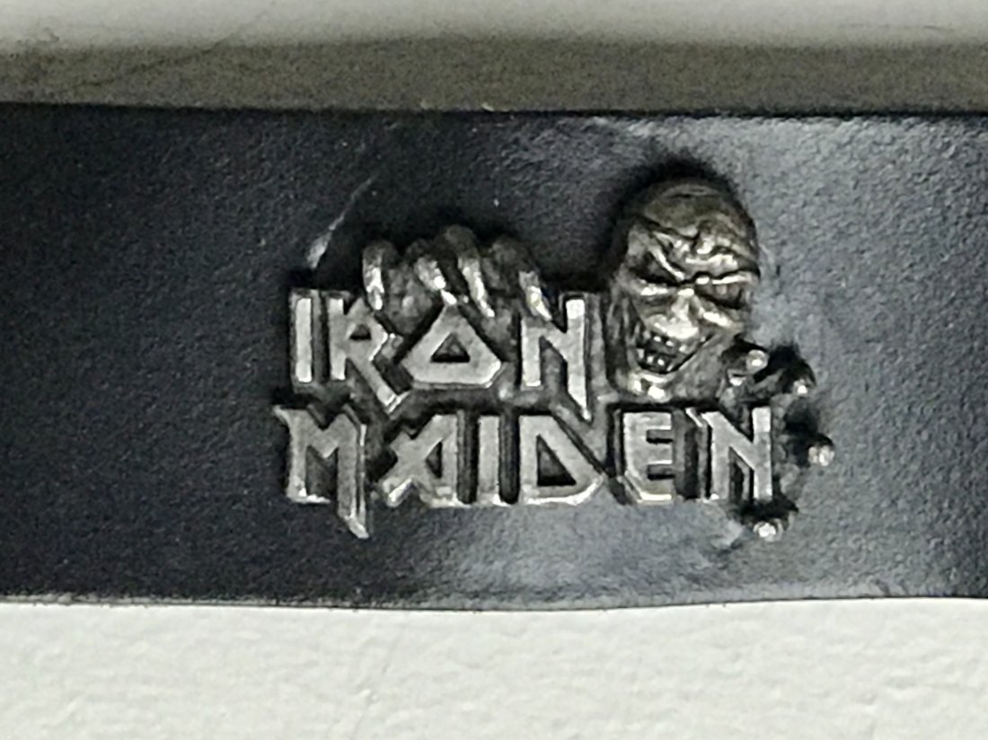 Iron Maiden Eddie Logo Leather Belt: Awesome Iron Maiden 40" belt in Italian leather with metal Iron Maiden "Eddie" logos across the belt and distressed metal buckle. This is official Iron Maiden merchandise in black genuine leather with