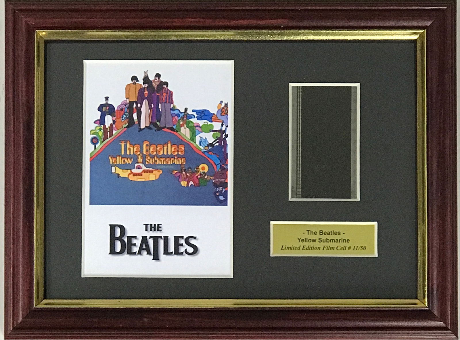 Beatles Yellow Submarine Film Cel Collage: Unique piece! Beatles Yellow Submarine genuine film cel, framed in a small collage. Featuring iconic image from the film. Framed in a special open-design floater frame with a clear back and front, thi
