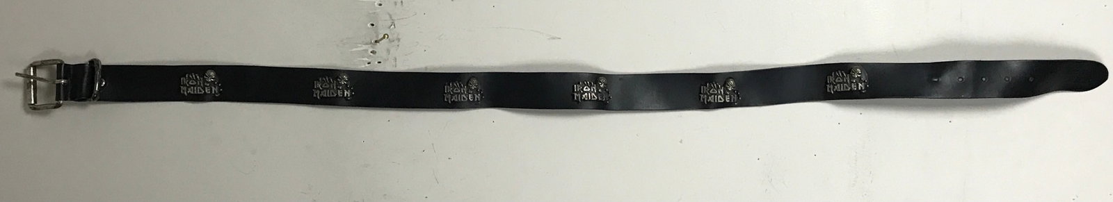 Iron Maiden Eddie Logo Leather Belt: Awesome Iron Maiden 40" belt in Italian leather with metal Iron Maiden "Eddie" logos across the belt and distressed metal buckle. This is official Iron Maiden merchandise in black genuine leather with