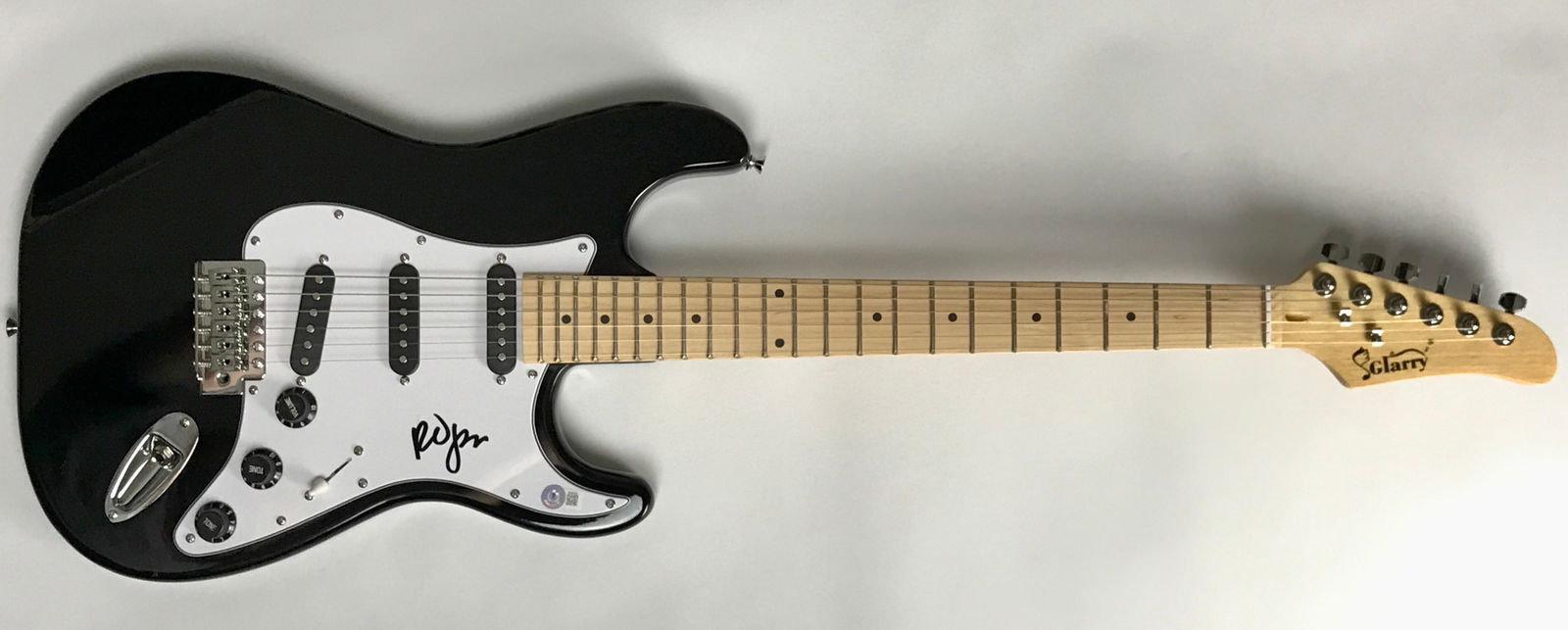 The Cure Robert Smith Signed Guitar w/BAS COA: Black guitar signed by lead singer/guitarist and founder of The Cure, Robert Smith. Signed by the Smith in black marker, this full size black guitar comes with a QR code certificate of authenticity fr