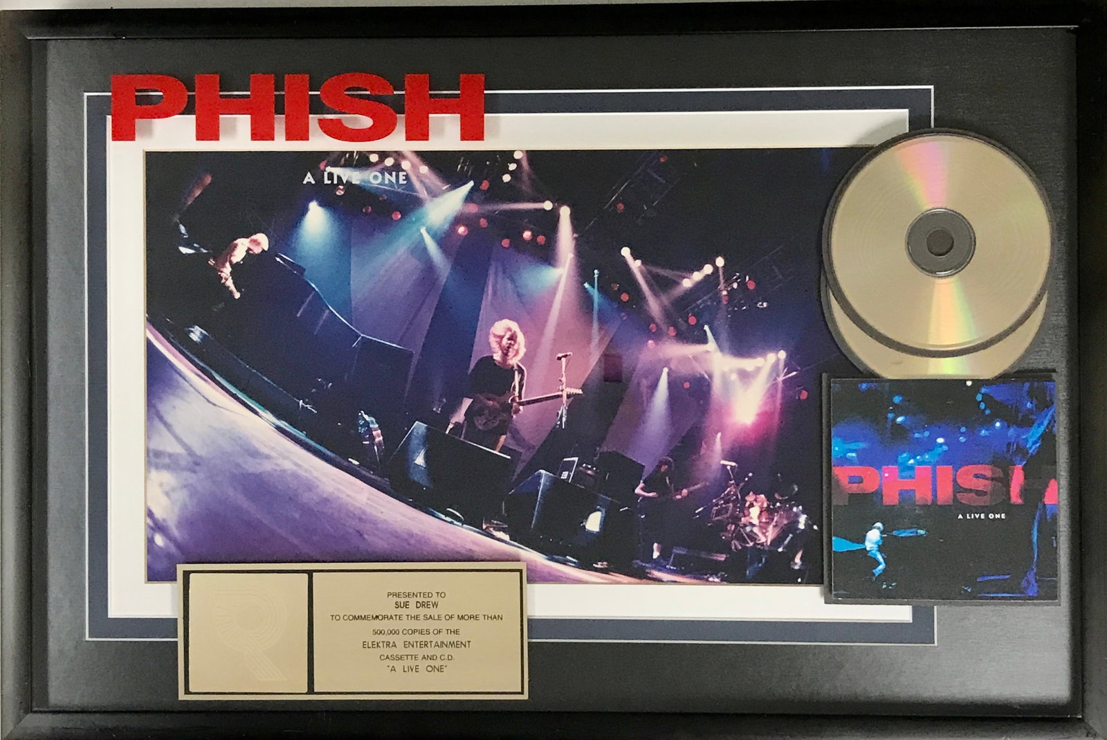 Phish A Live One RIAA Gold Album Award: RIAA Gold Album award for Phish Live One. The album was released on June 27, 1995 and by Nov. 10, 1995 was certified Gold by the RIAA for 500,000 copies sold. Hard to find Phish RIAA award.</