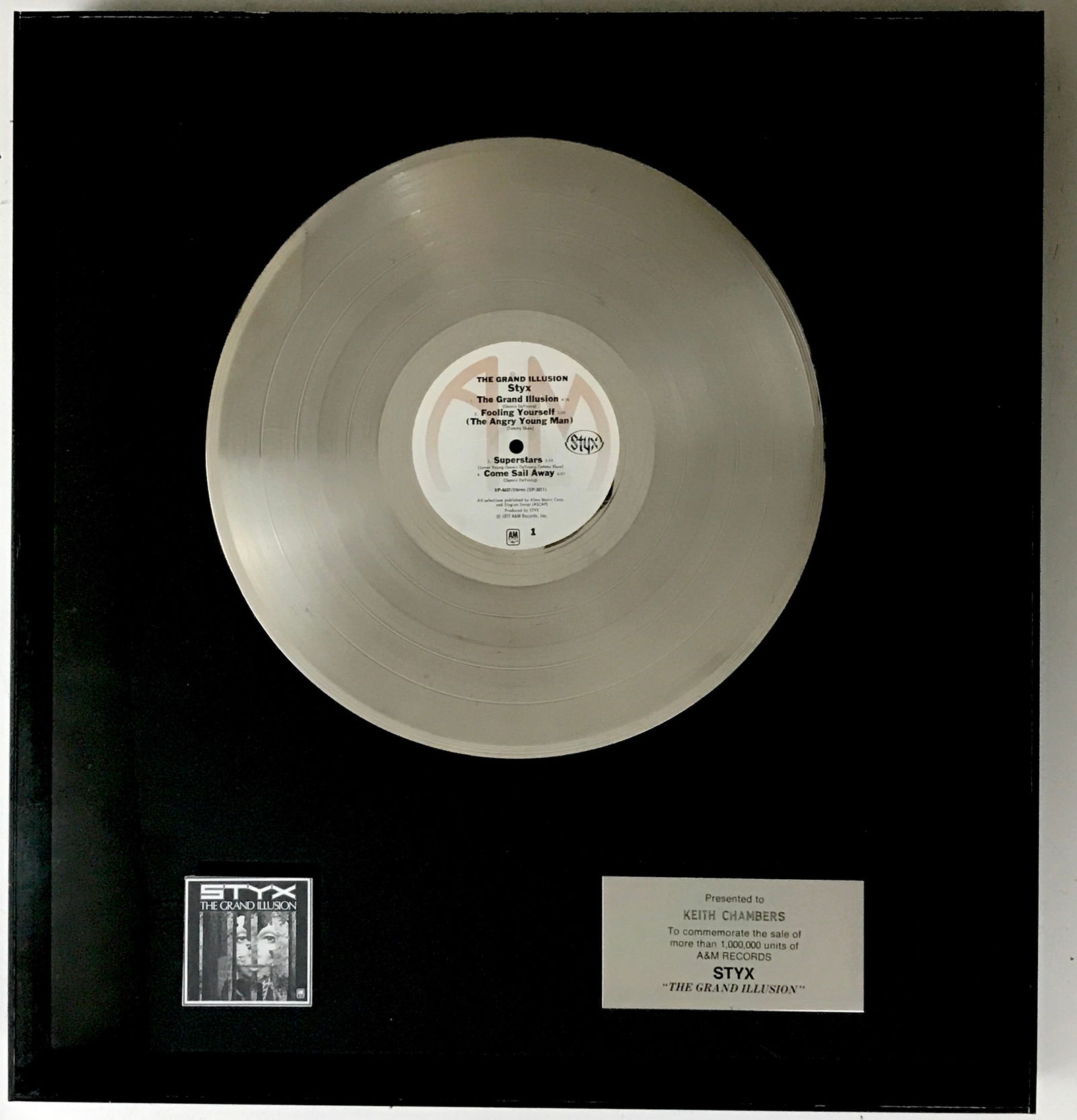 Styx The Grand Illusion 70s A&M Records Award: A&M Records 1970s label award for Styx album The Grand Illusion. Released on July 7, 1977, it featured the hit singles "Come Sail Away" and "Fooling Yourself", and the title track also got much ra