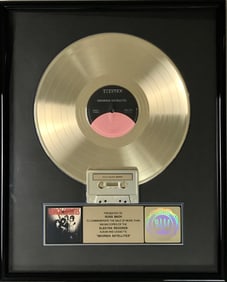 Georgia Satellites debut RIAA Platinum LP Award presented to group's drummer