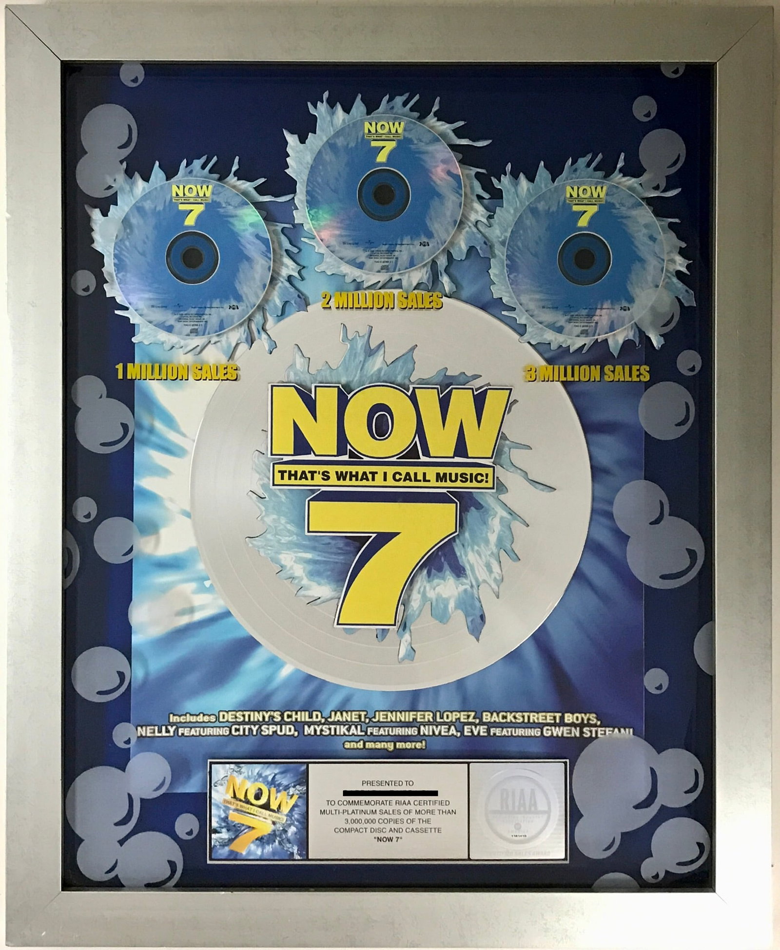 NOW 7 Multi-Artist RIAA 3x Multi-Platinum Award: RIAA 3x Multi-Platinum Album Award for multi-artist album NOW 7 (officially titled Now That's What I Call Music! 7). Released on July 30, 2001 the album was certified 3x Multi-Platinum by the RIAA for