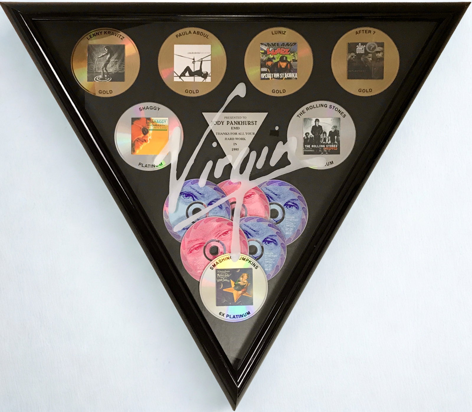 Virgin Records Smashing Pumpkins, Stones +4 Multi-Artist Award: Virgin Records 1995 combo award for EMI artists After 7, Paula Abdul, Lenny Kravitz, Luniz, Rolling Stones, Shaggy, and Smashing Pumpkins (who are featured most prominently on this award). The award r