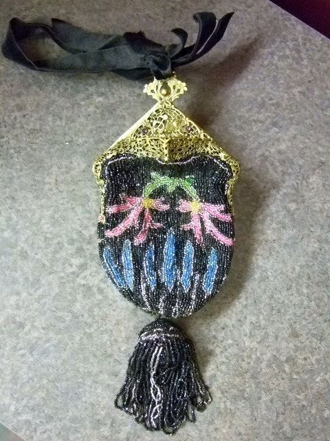 Antique French Glass Beaded Purse: Antique French glass beaded purse with ornate German silver (in brass tone) metal worked frame with jeweled decoration. Very unusual diamond shaped top with tasseled center bottom. Very unusual form,