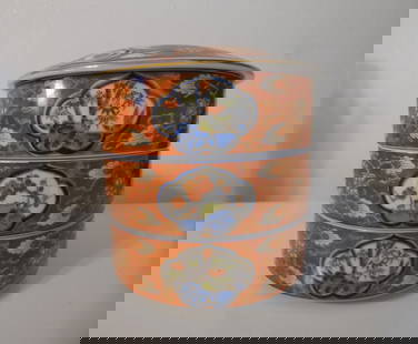 Large Takahashi Stacked Japanese Food Bowls; Japanese Decorative Porcelain; Home Décor: DescriptionThis large Takahashi stacked food bowl is round and has three separate bowls plus the lid. The deep red -orange color is highlighted with dark blue, celadon green and gold accents. There is