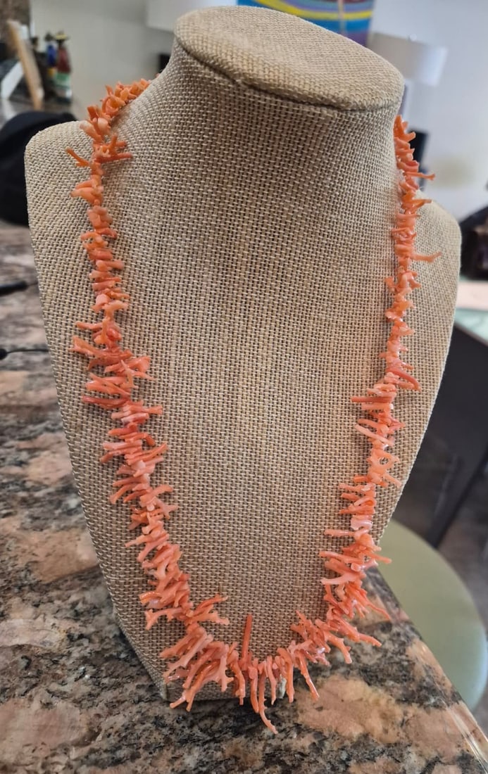 Vintage Natural Salmon Branch Coral Strand Necklace: A beautiful and organic vintage strand necklace featuring genuine natural branch coral (also known as stick coral). The coral displays a vibrant, rich salmon-orange hue with natural variations that hi