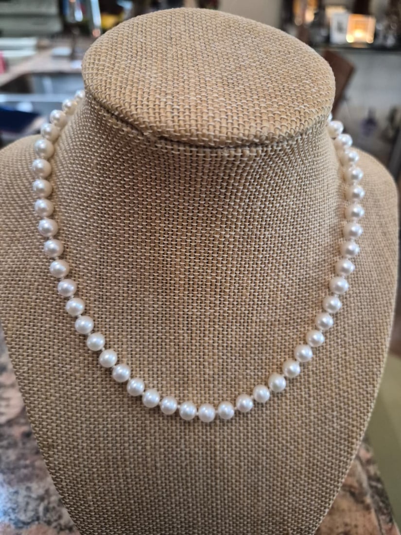 Classic Cultured Akoya Sea Pearl Strand Necklace with 14K Yellow Gold Clasp: A timeless and elegant single-strand necklace featuring genuine cultured Akoya sea pearls. The pearls are hand-knotted on silk thread and exhibit an exceptional, deep mirror-like luster with clean sur
