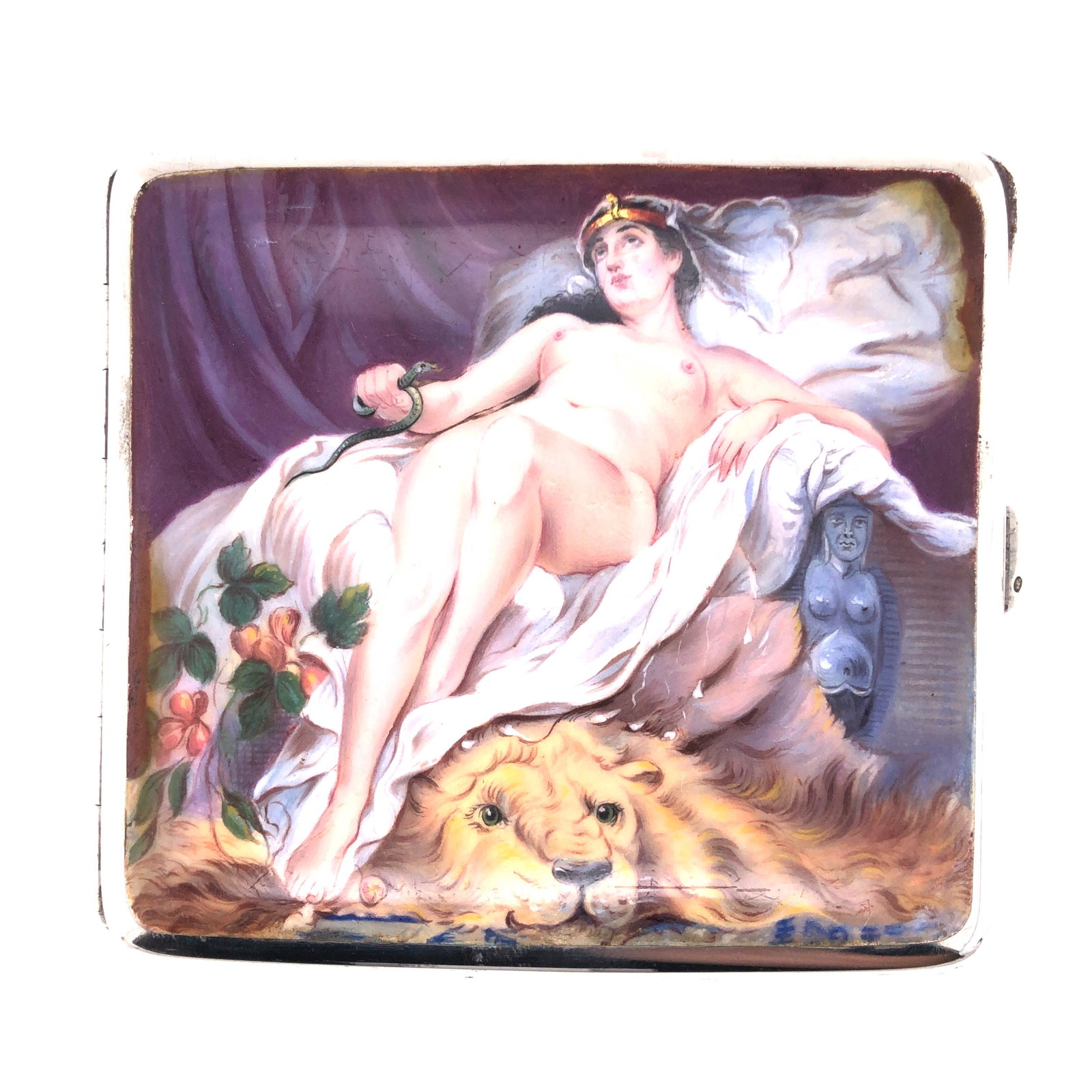 Erotic Cigarette Case, Woman Reclining Beside Lion: Erotic cigarette case showing a reclining nude woman sitting on a seat with drapes, holding a snake, atop a lion rug. Hallmarked 925 with 'GS' makers marks and other indistinct marks ' S&? Ltd', 1922,