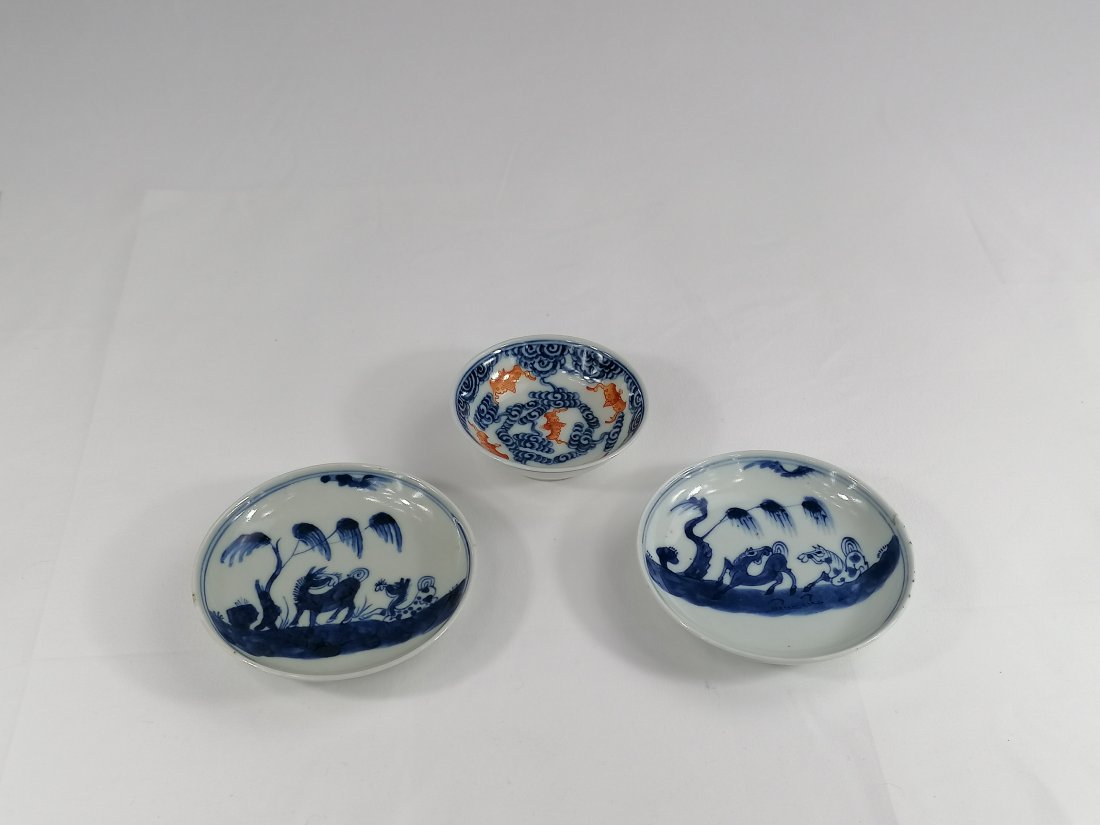 Three Chinese blue and white porcelain saucers: 18 and 20th century, Qing dynasty, a pair blue and white horses rest under willow, Jiaqing mark and period 10.3cm , other small saucer, five iron-red bats cross blue clouds, Xuantong mark 8.3cm diamet