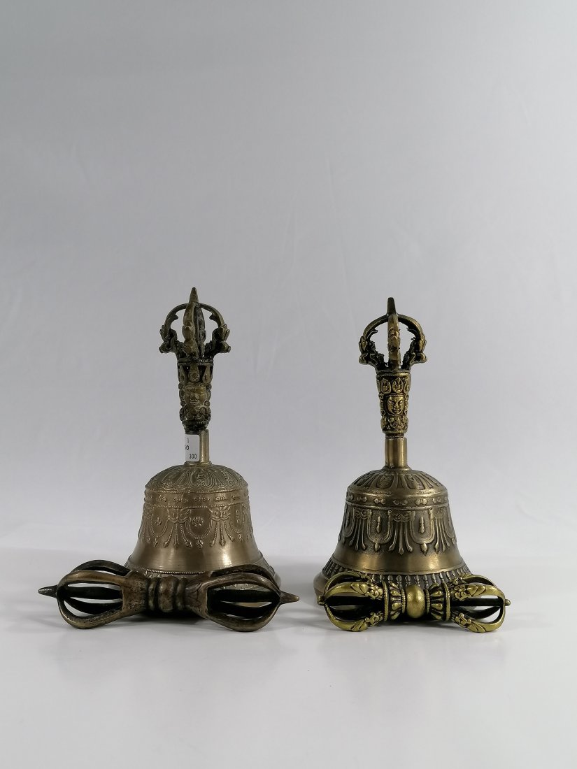 Two pairs of Tibetan Buddhist Vajra and bells: 19/20th century Tibetan/Himalayan ritual Vajra and bells vajras have five prongs that symbolize the five wisdoms that are attained through the transcendance of five kleshas (greed, anger, delusion, pr