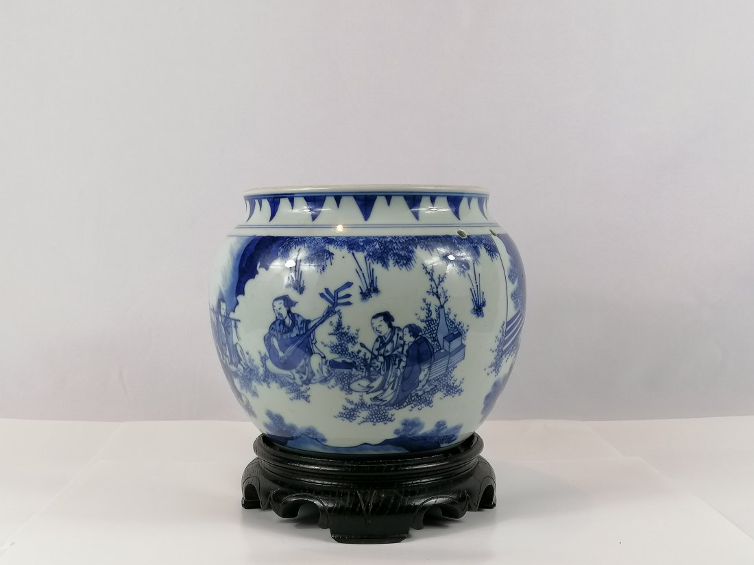 A blue and white porcelain Jar: Ming Dynasty, Chongzhen Period, the compressed jar with short neck, decorated with nine scholars with an inscription Xiangshan jiu lao tu (nine elders of the mountain of fragrance), two holes for hand