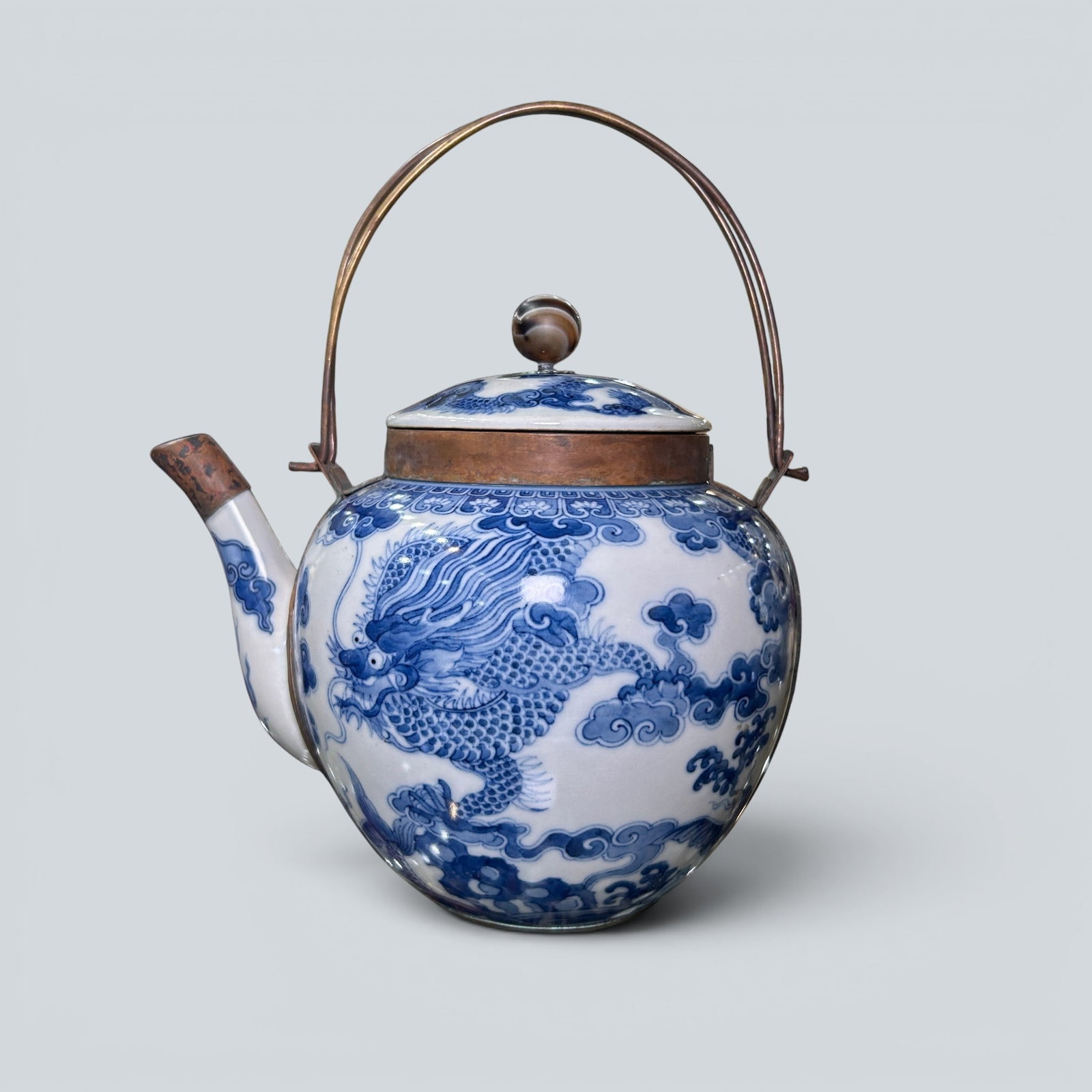Chinese Art, A Blue and White 'Dragon' Ewer, 17th-18th Century, Qing Dynasty: Chinese Art, A Blue and White 'Dragon' Ewer, 17th-18th Century, Qing Dynasty, Height 16.3 cm.