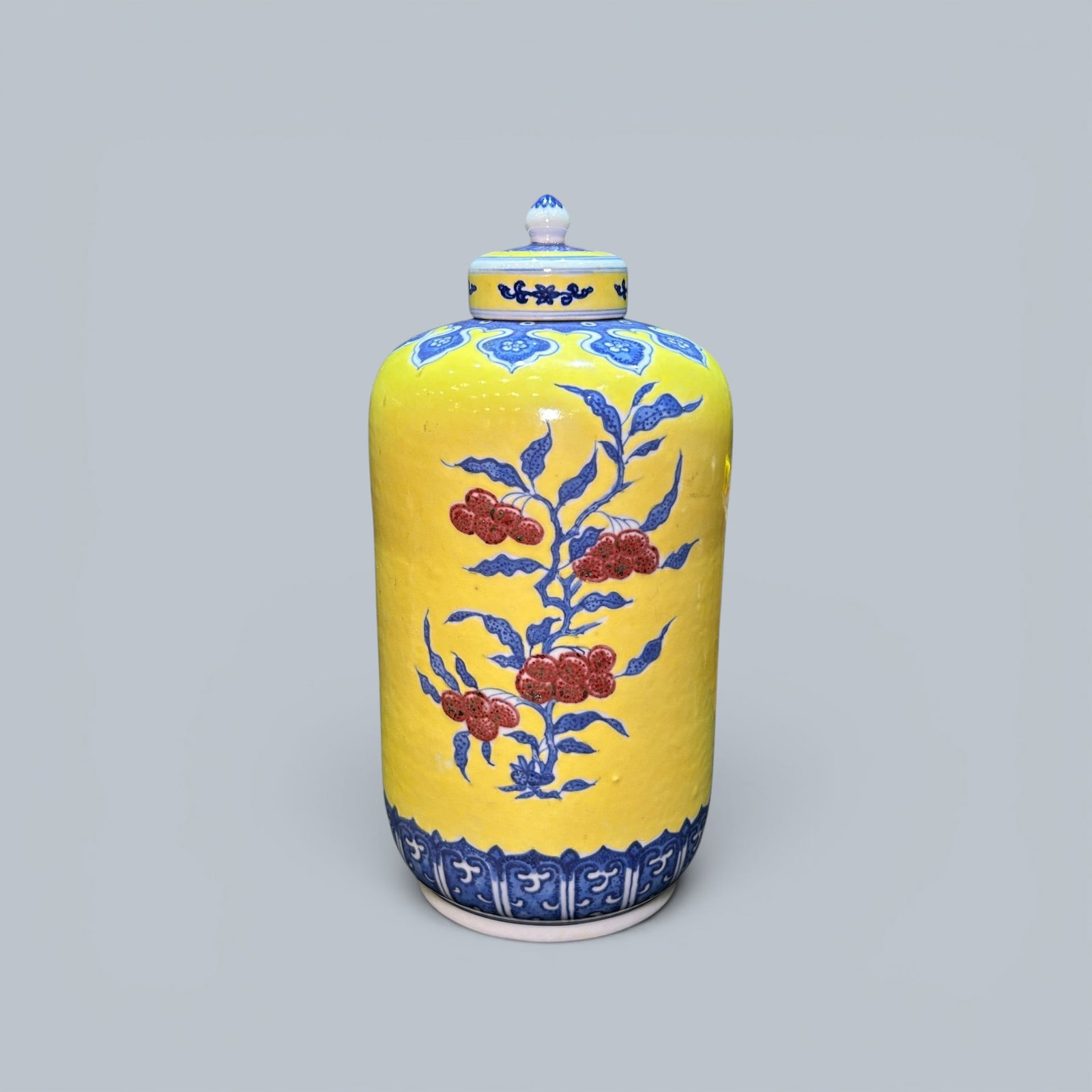 Chinese Art, A Yellow-Glazed Blue and White and Underglaze Red Covered Vase Decorated with Melons: Chinese Art, A Yellow-Glazed Blue and White and Underglaze Red Covered Vase Decorated with Melons and Fruits, 18th Century, Qing Dynasty, Height 27.3 cm.
