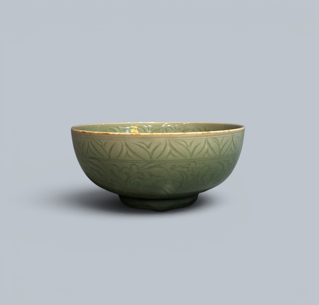 Chinese Art, A Celadon Bowl with Incised Floral Decoration, 14th-15th Century, Ming Dynasty: Chinese Art, A Celadon Bowl with Incised Floral Decoration, 14th-15th Century, Ming Dynasty, Height 8.7 cm, Diameter 19 cm.