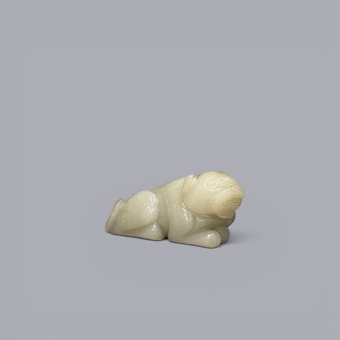 Chinese Art, A White Jade Mythical Beast, 17th-19th Century, Qing Dynasty: Chinese Art, A White Jade Mythical Beast, 17th-19th Century, Qing Dynasty, Length 10.8 cm, Height 4.7 cm.