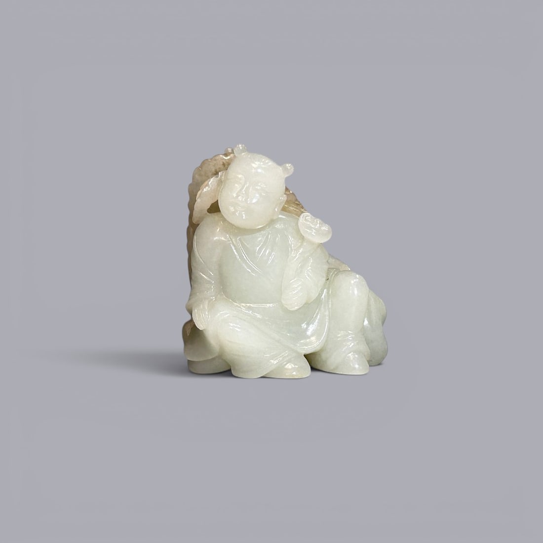 Chinese Art, A White Jade Figure of a Boy, 17th-18th Century, Qing Dynasty: Chinese Art, A White Jade Figure of a Boy, 17th-C18th Century, Qing Dynasty, Height 4.6 cm, Width 5.4 cm.