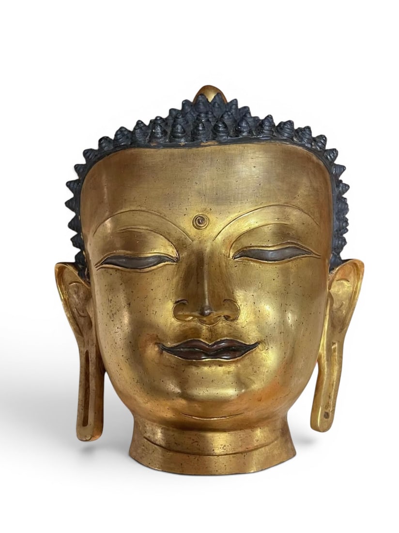Himalayan Art, Tibet, A Large Gilt-Bronze Head of Buddha with Silver Inlay, 16th-17th Century: Himalayan Art, Tibet, A Large Gilt-Bronze Head of Buddha with Silver Inlay, 16th to 17th Century, Height 40 cm, Width 32 cm.