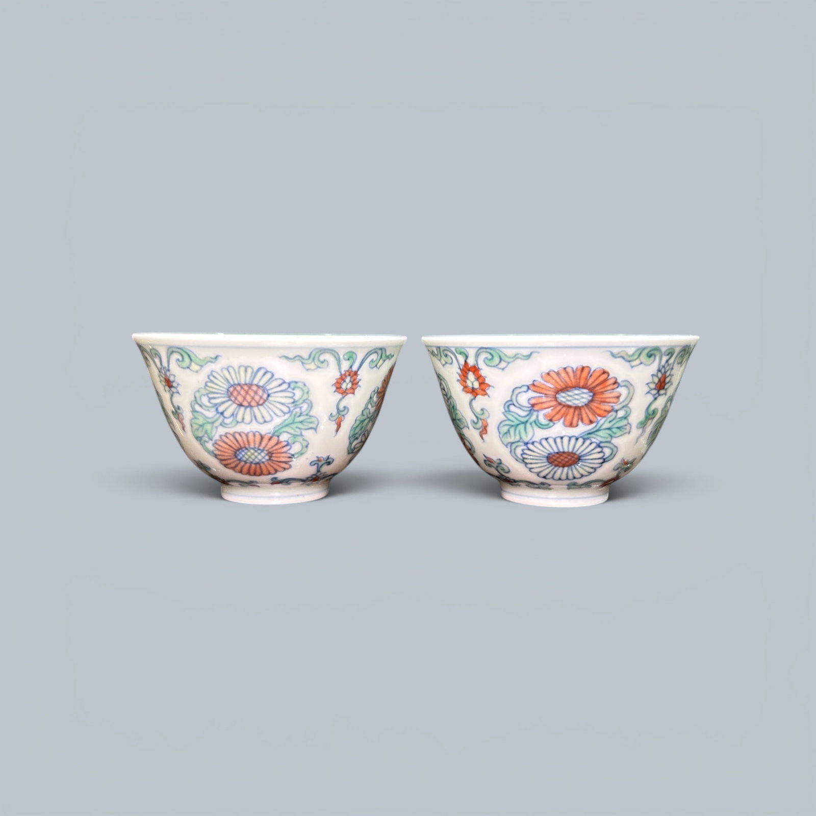 Chinese Art, A Pair of Doucai Cups Decorated with Chrysanthemums, 15th Century, Ming Dynasty: Chinese Art, A Pair of Doucai Cups Decorated with Chrysanthemums, 15th Century, Ming Dynasty, Height 4 cm, Diameter 6.5 cm.