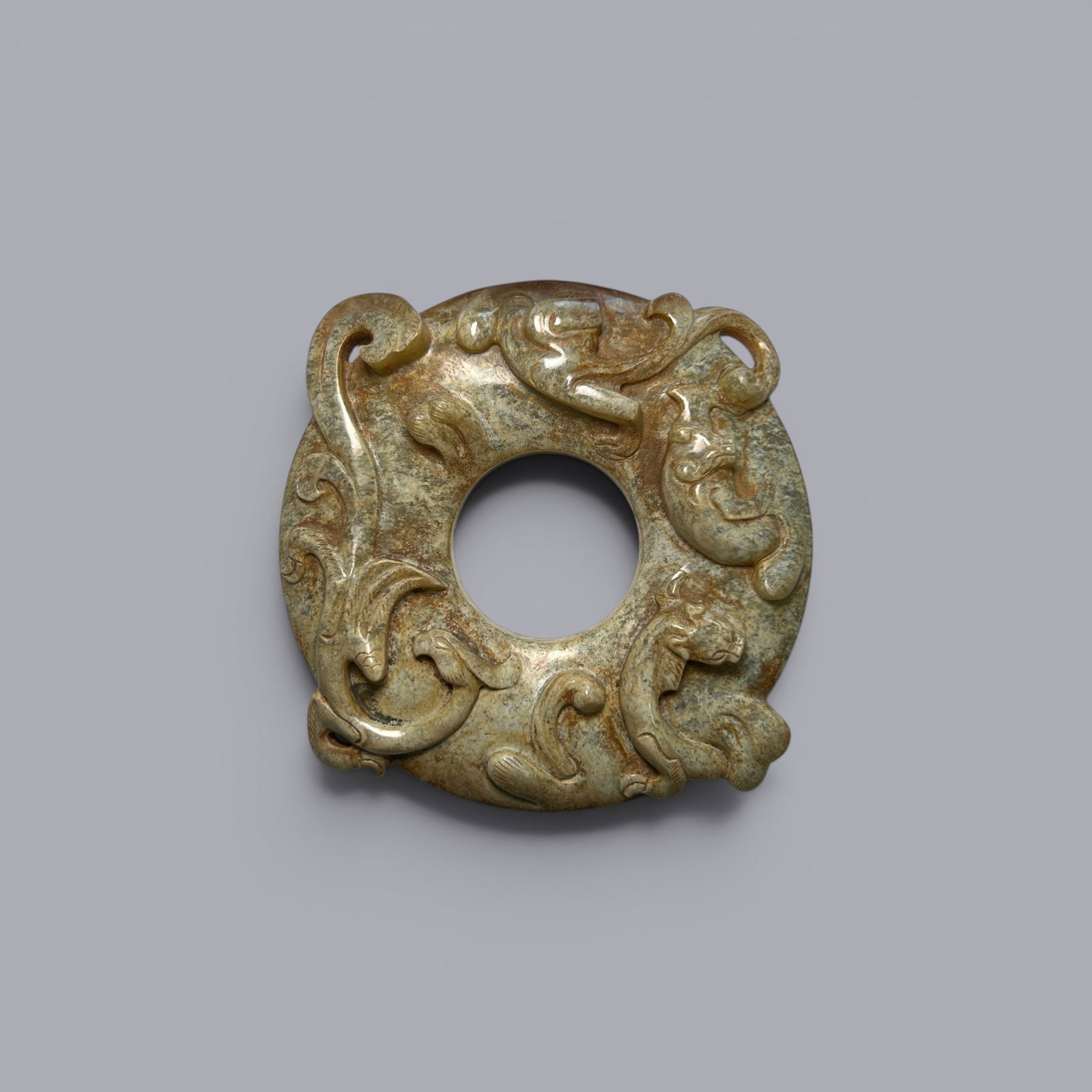 Chinese Art, A Jade Ring Carved with Chi Dragons, 3rd Century BC-3rd Century AD, Han Dynasty: Chinese Art, A Jade Ring Carved with Chi Dragons, 3rd Century BC-3rd Century AD, Han Dynasty, Width 10.7 cm, Length 11.2 cm.