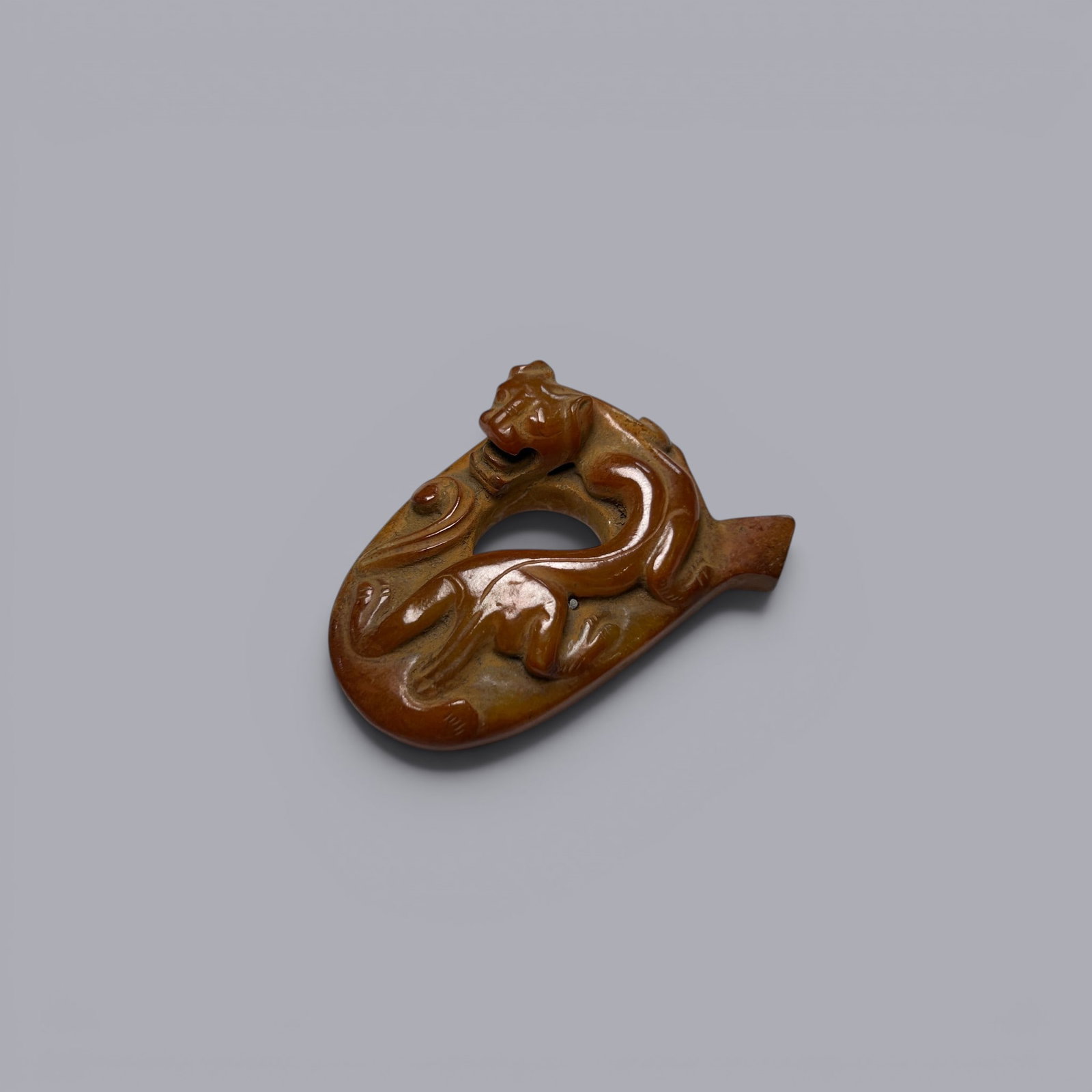 Chinese Art, A Jade Pendant Decorated with Dragons, 3rd Century BC-3rd Century AD, Han Dynasty: Chinese Art, A Jade Pendant Decorated with Dragons, 3rd Century BC-3rd Century AD, Han Dynasty, Length 5.1 cm, Width 3.7 cm, Height 1.6 cm .