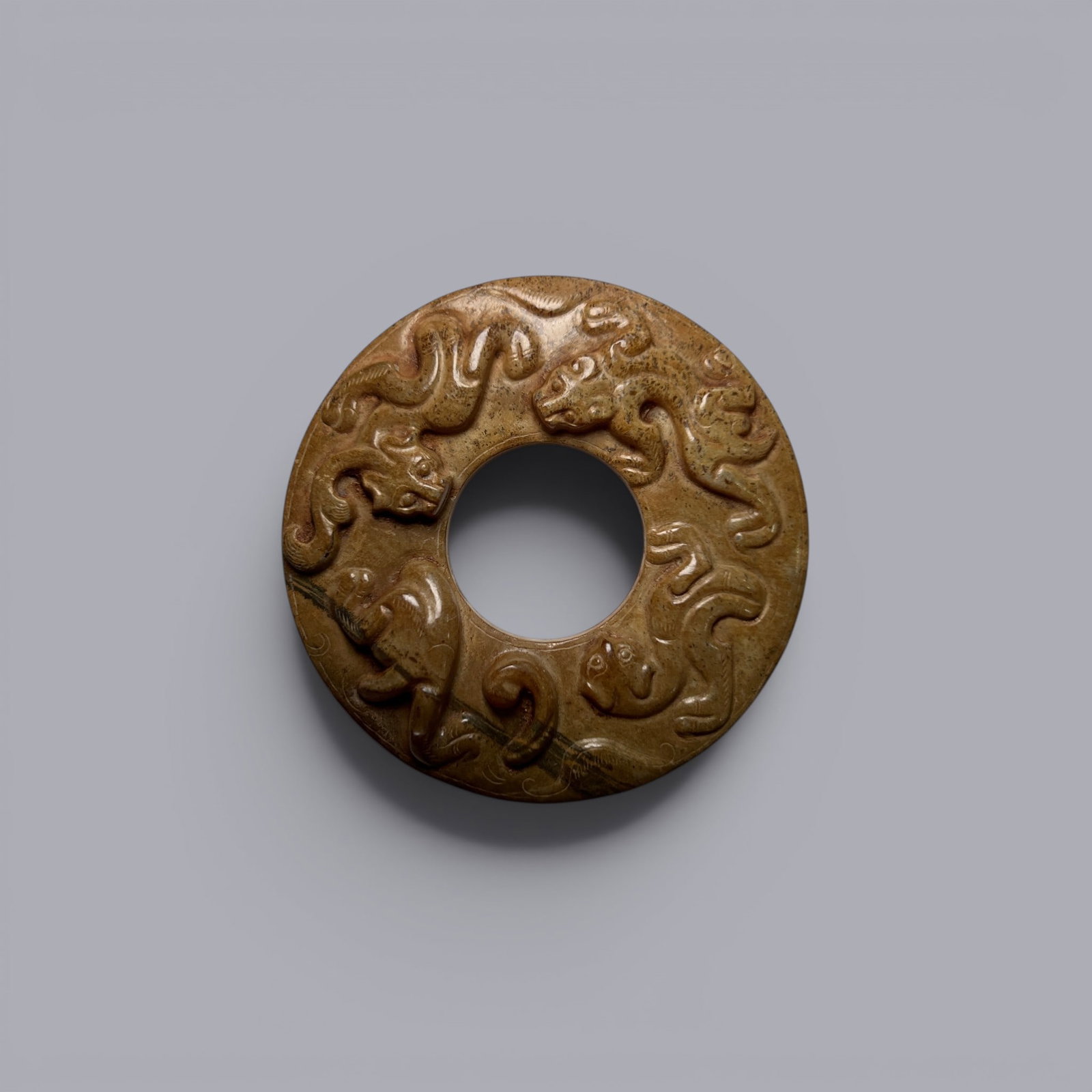 Chinese Art, A Jade Ring Decorated with Dragons, 3rd Century BC-3rd Century AD, Han Dynasty: Chinese Art, A Jade Ring Decorated with Dragons, 3rd Century BC-3rd Century AD, Han Dynasty, Diameter 6.7 cm.