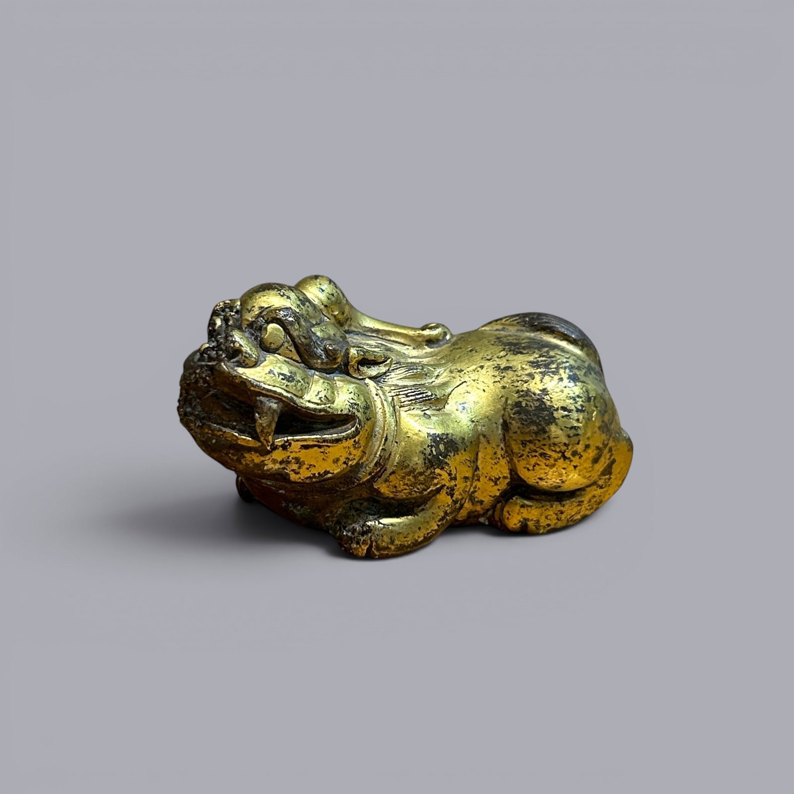 Chinese Art, A Gilt-Bronze Animal Figure, 3rd Century BC-3rd Century AD, Han Dynasty: Chinese Art, A Gilt-Bronze Animal Figure, 3rd Century BC-3rd Century AD, Han Dynasty, Height 3.3 cm, Length 6.7 cm, Width 3.1 cm.