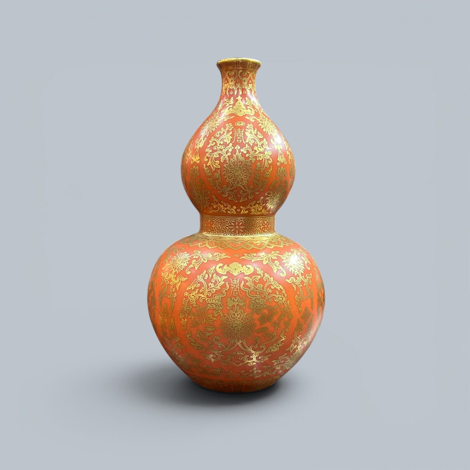 Chinese Art, A Iron-Red and Gilt Double-Gourd Vase, 18th Century, Qing Dynasty: Chinese Art, A Iron-Red and Gilt Double-Gourd Vase, 18th Century, Qing Dynasty, Height 27 cm.