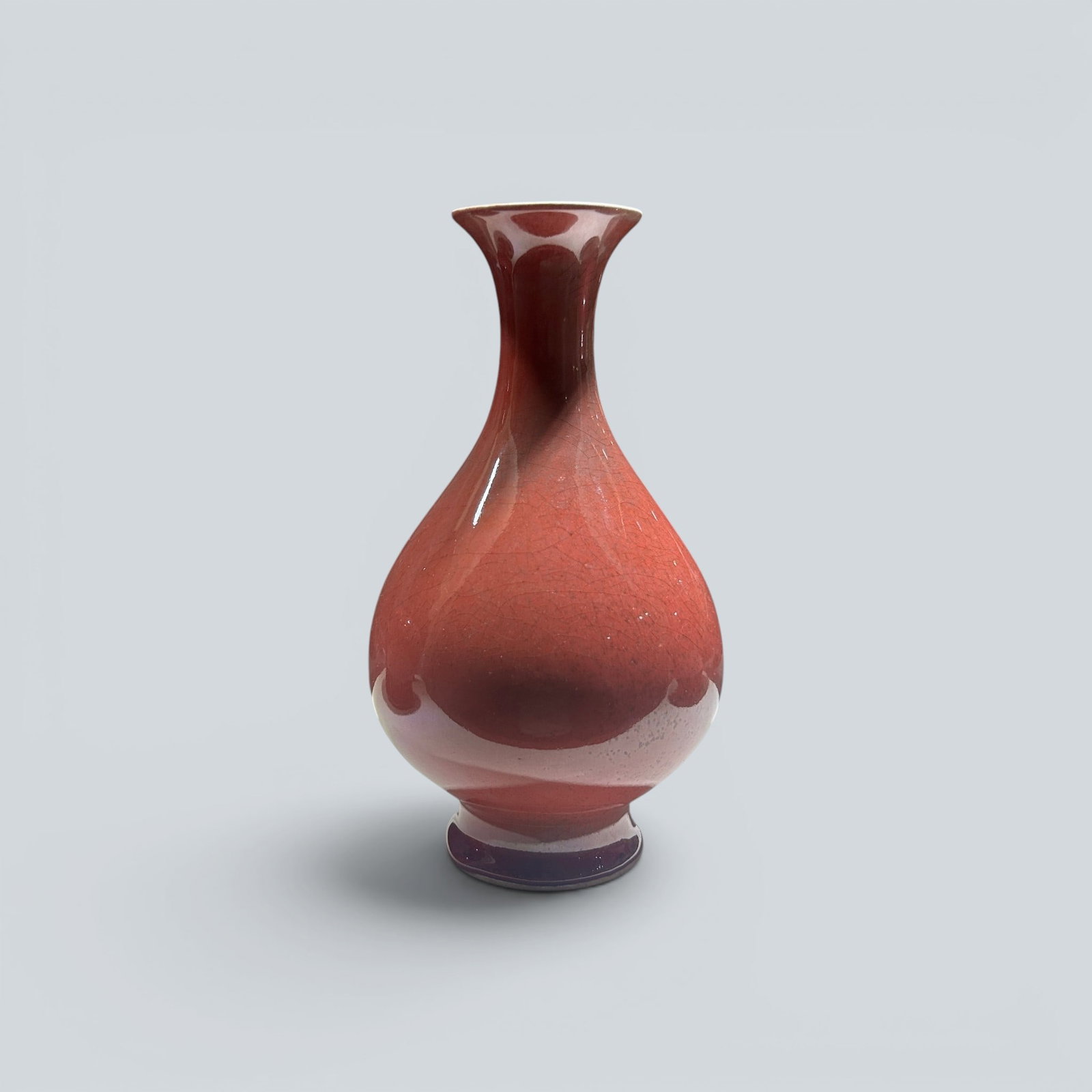 Chinese Art, A Red-Glazed Vase, 17th-18th Century, Qing Dynasty: Chinese Art, A Red-Glazed Vase, 17th-18th Century, Qing Dynasty, Height 26.7 cm.