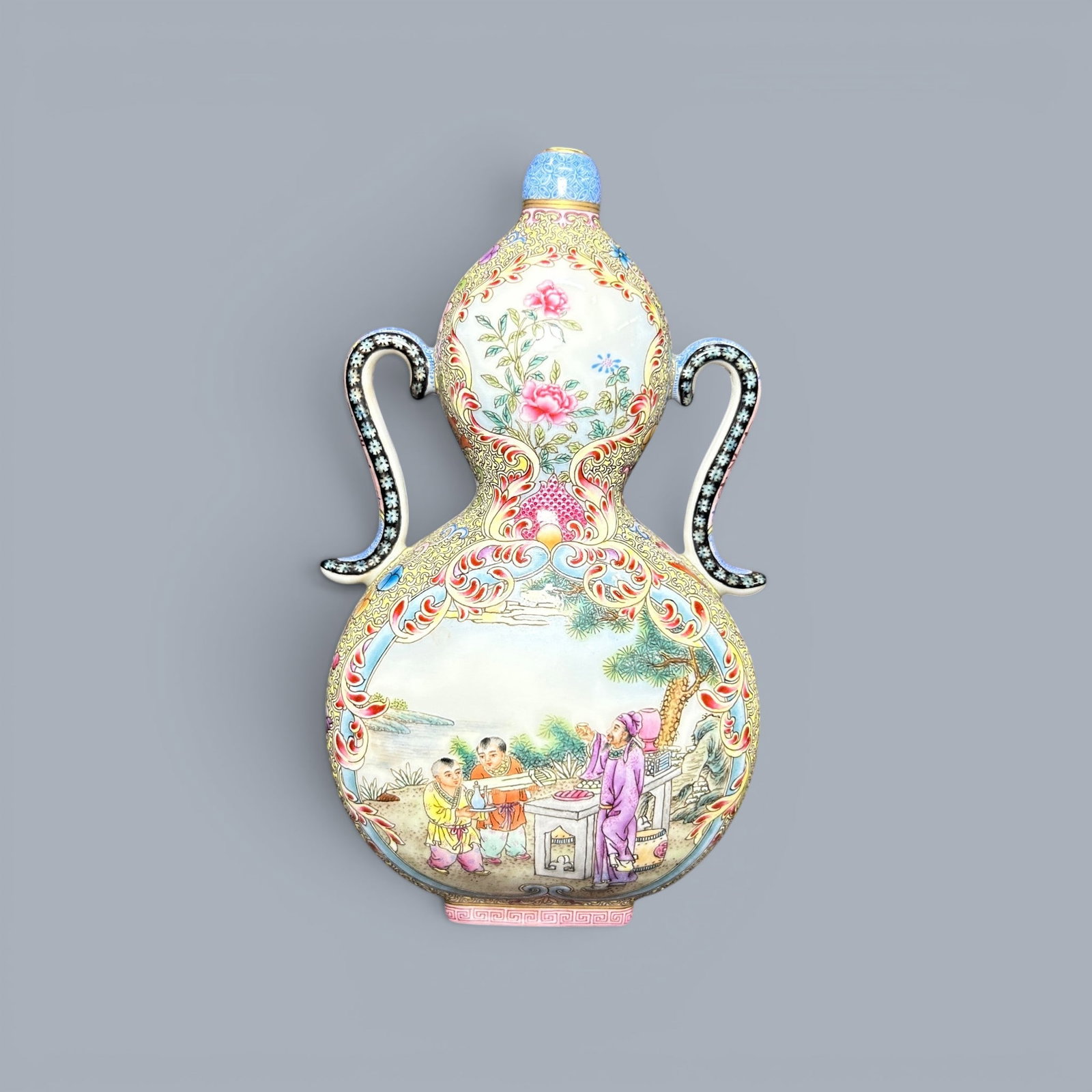 Chinese Art, A Famille Rose Double-Gourd Vase Decorated with Figures, 18th Century, Qing Dynasty: Chinese Art, A Famille Rose Double-Gourd Vase Decorated with Figures, 18th Century, Qing Dynasty, Height 16.3 cm.
