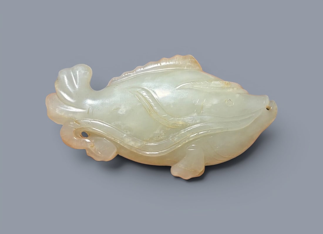 Chinese Art, A Jade Fish, 16th Century, Ming Dynasty: Chinese Art, A Jade Fish, 16th Century, Ming Dynasty, Length 8.8 cm, Height 4.8 cm, Width 2 cm.